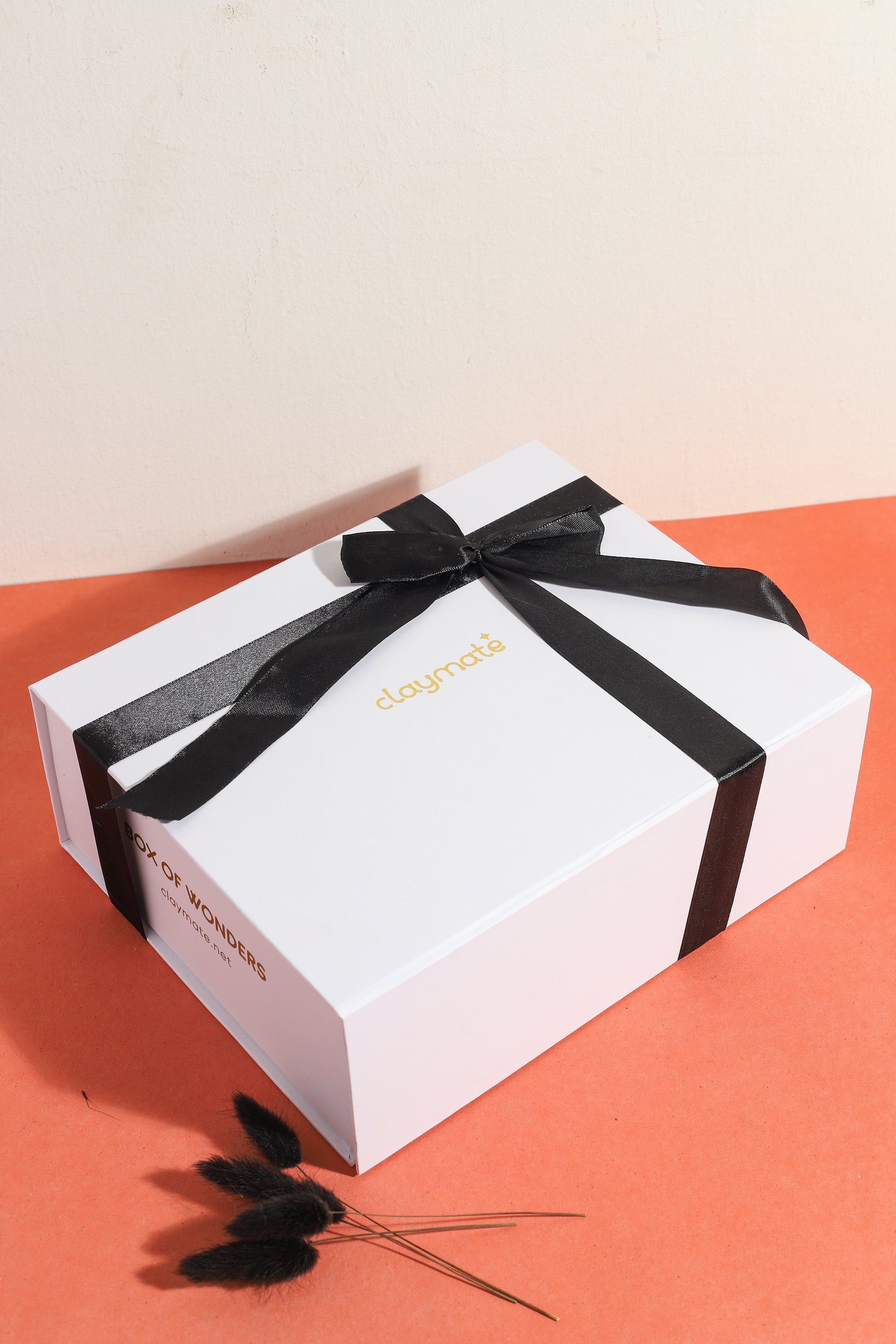 Special Claymate gift box with black ribbon.