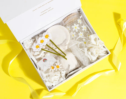 Daisy floral gift box on yellow background