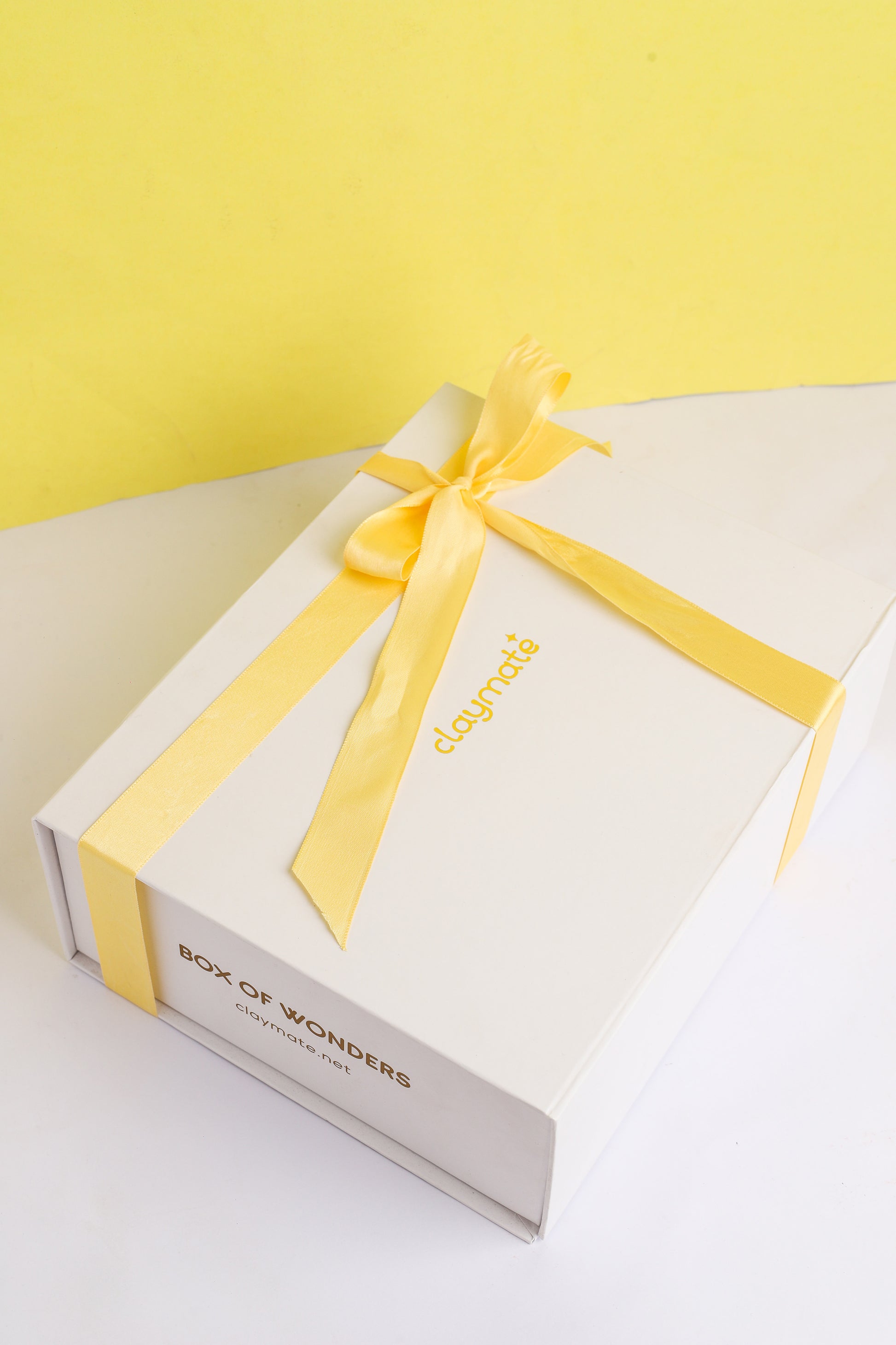 Gift box with yellow ribbon.